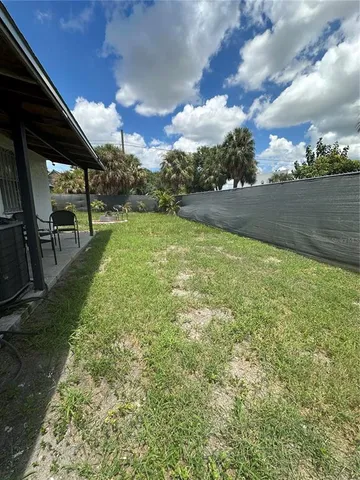 a view of a yard with an outdoor seating