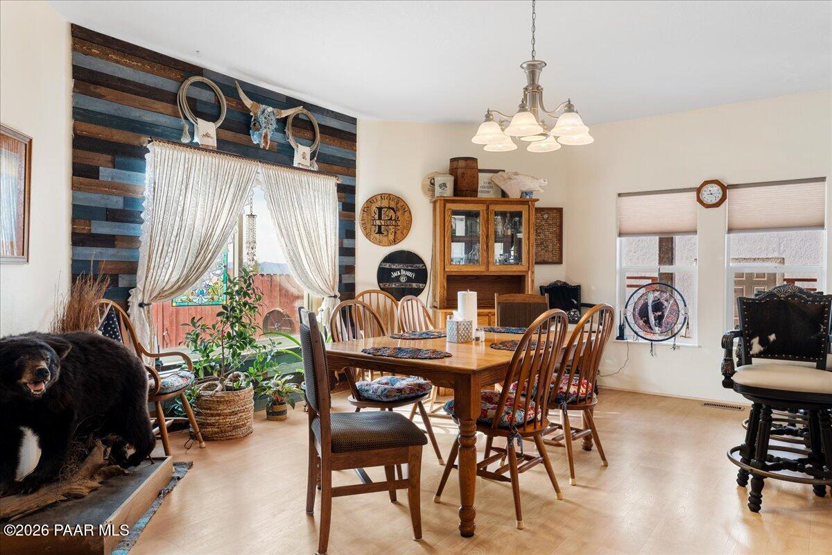 8475 West Red Rock Road Kirkland, AZ 86332 - Photo 16 of 39 a dining room with furniture and window