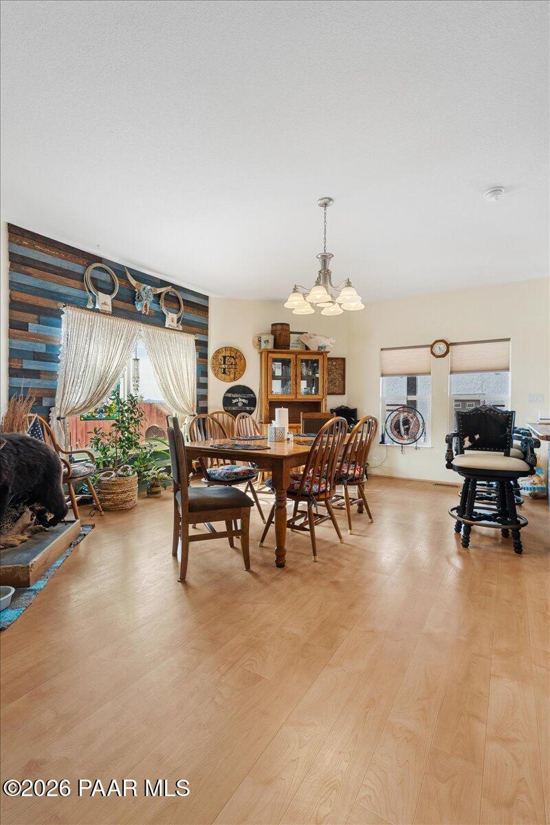 8475 West Red Rock Road Kirkland, AZ 86332 - Photo 17 of 39 a living room with furniture and a table