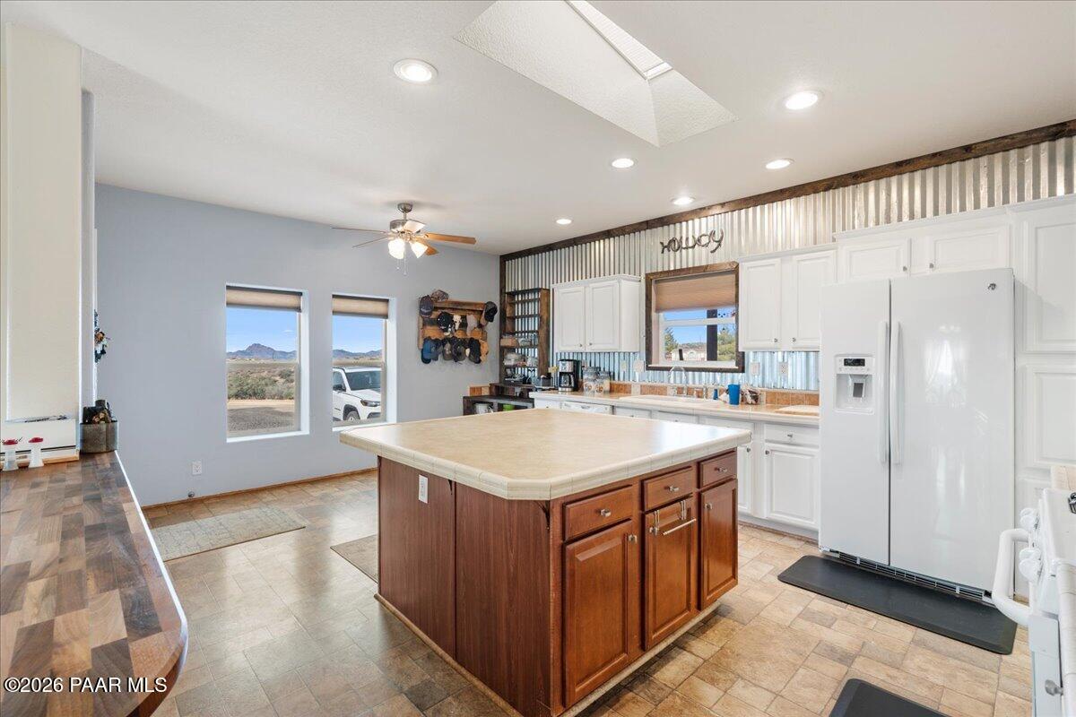 8475 West Red Rock Road Kirkland, AZ 86332 - Photo 19 of 39 a kitchen with a sink stove and refrigerator