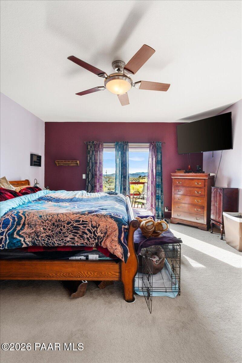 8475 West Red Rock Road Kirkland, AZ 86332 - Photo 23 of 39 a bedroom with a bed and window