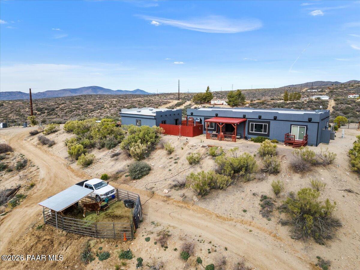 8475 West Red Rock Road Kirkland, AZ 86332 - Photo 37 of 39 a view of a terrace with a garden