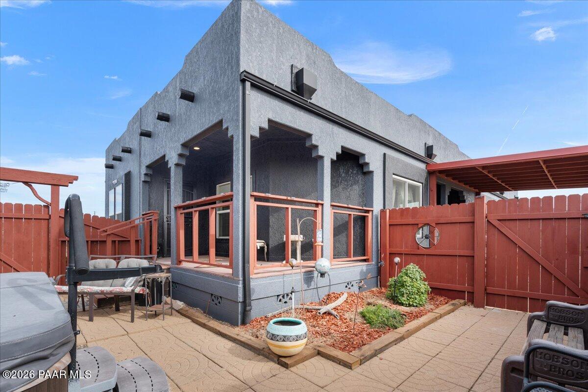 8475 West Red Rock Road Kirkland, AZ 86332 - Photo 6 of 39 a front view of a house with outdoor seating and stairs