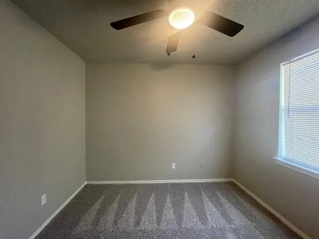 an empty room with a empty space and a window