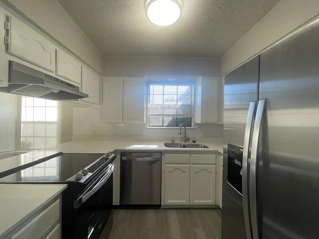 6413 Alta Vista Drive Watauga, TX 76148 - Photo 5 of 21 a kitchen with a sink a refrigerator and window