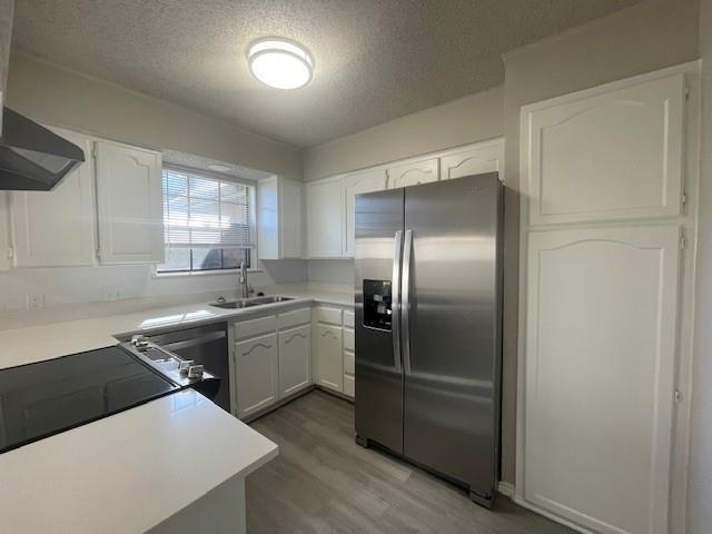 6413 Alta Vista Drive Watauga, TX 76148 - Photo 6 of 21 a kitchen with a sink stove and refrigerator