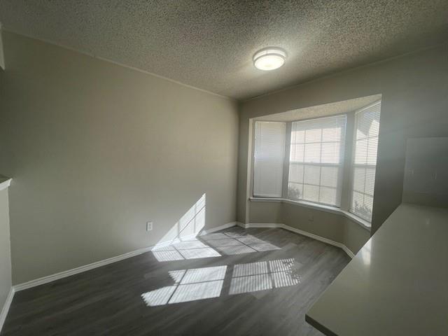 6413 Alta Vista Drive Watauga, TX 76148 - Photo 7 of 21 a view of wooden floor and windows in a room