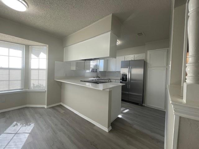 6413 Alta Vista Drive Watauga, TX 76148 - Photo 8 of 21 a kitchen with stainless steel appliances granite countertop a refrigerator and a sink