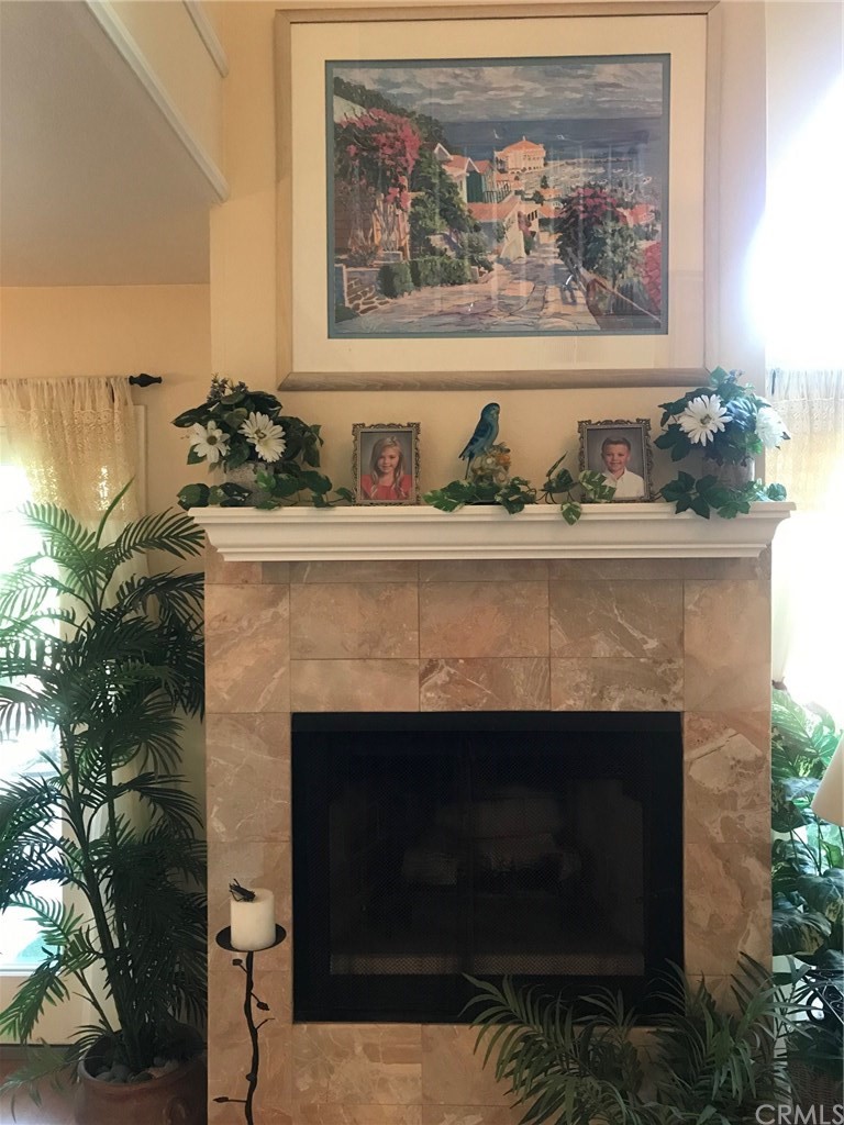 6053 Loynes Drive Long Beach, CA 90803 - Photo 17 of 21 a living room with a fireplace and wooden floor