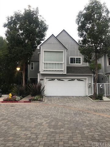 a kitchen with stainless steel appliances a stove a sink and a cabinets