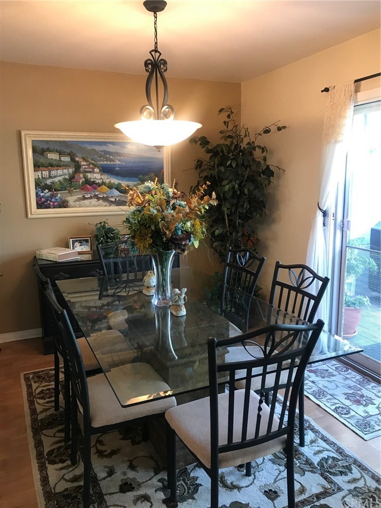 6053 Loynes Drive Long Beach, CA 90803 - Photo 8 of 21 a view of a dining room with furniture window and outside view