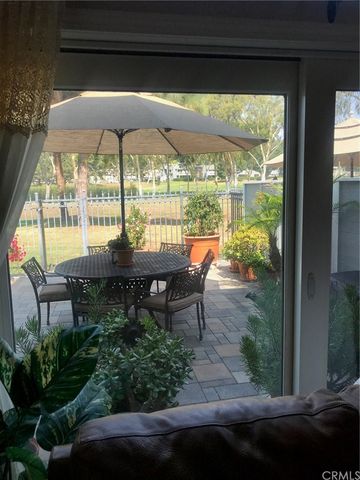 an outdoor space with patio lots of furniture and umbrella