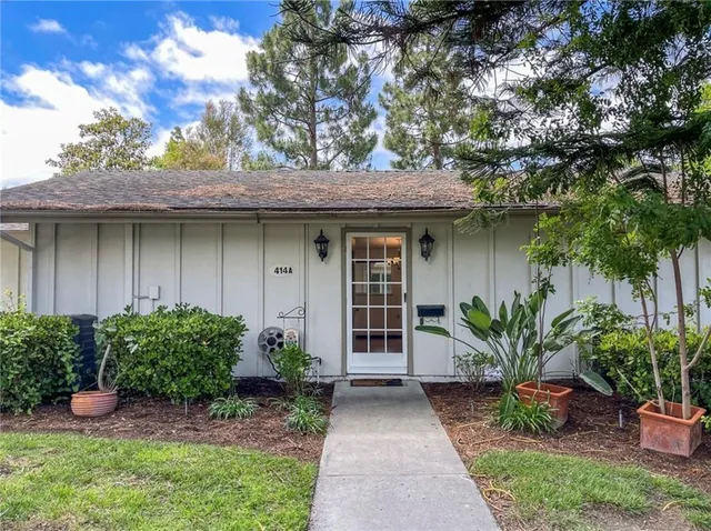 a view of a potted plants in front of a house
