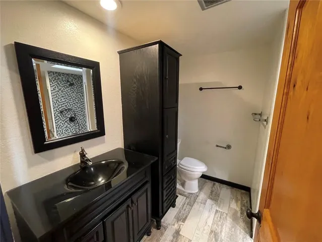 a bathroom with a sink and a toilet
