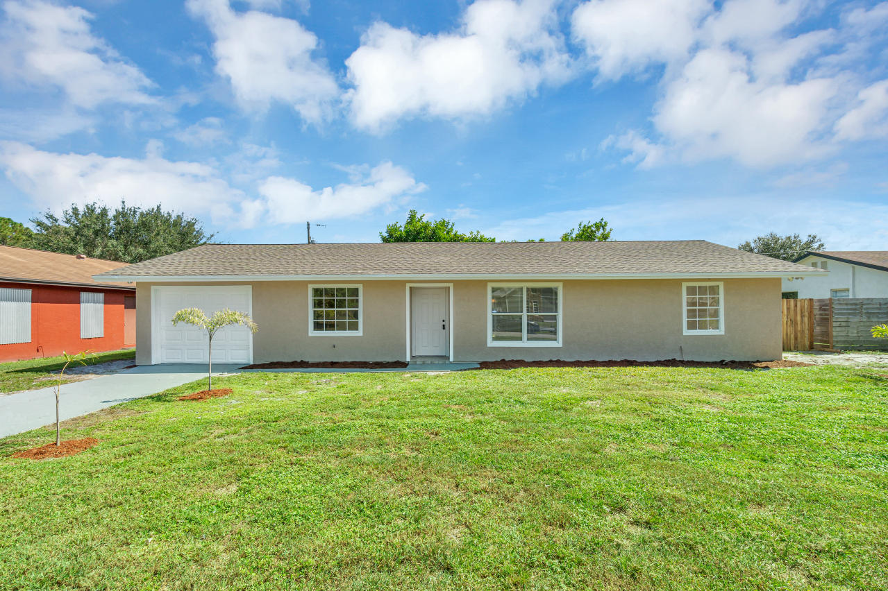 3526 Ivanhoe Avenue Boynton Beach, FL 33436 - Photo 1 of 29 a view of a yard in front of a house