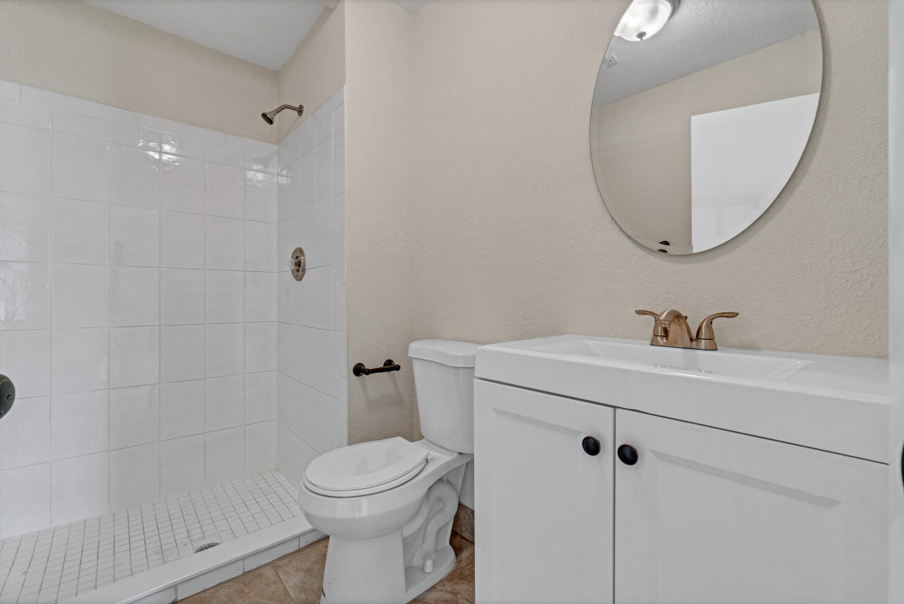 3526 Ivanhoe Avenue Boynton Beach, FL 33436 - Photo 17 of 29 a bathroom with a sink a toilet and shower