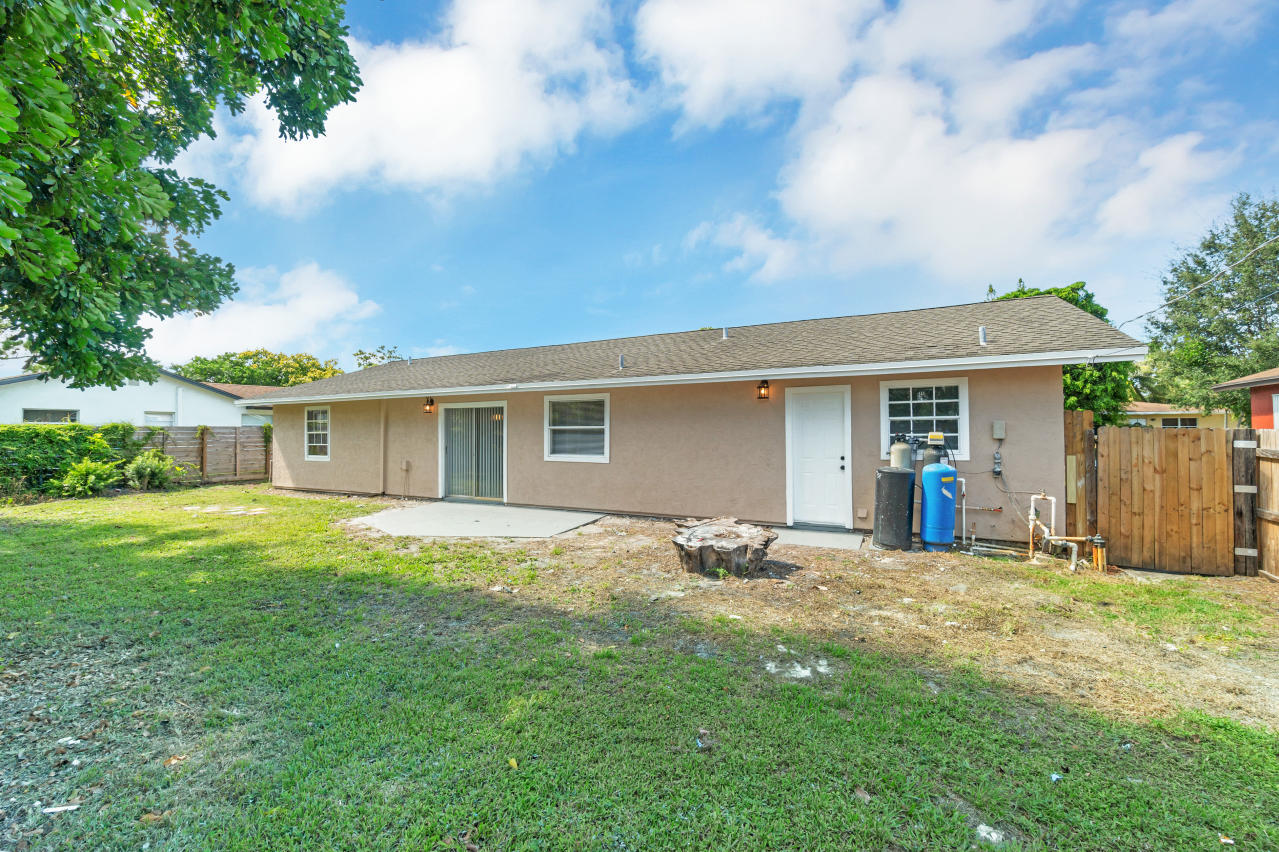 3526 Ivanhoe Avenue Boynton Beach, FL 33436 - Photo 26 of 29 a front view of a house with a yard and trees