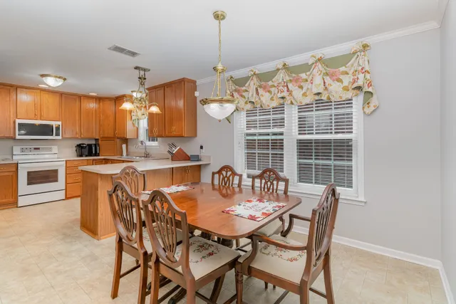 a kitchen with stainless steel appliances a stove sink and cabinets