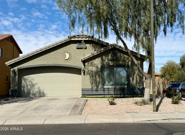 a side view of a house with a yard