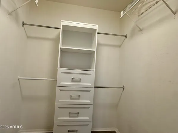 a walk in closet with a shower