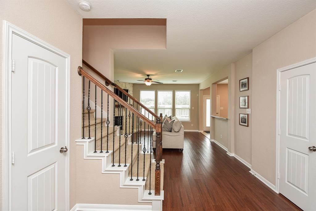 7002 Edwanna Lane Spring, TX 77389 - Photo 2 of 17 a view of an entryway with wooden floor and stairs