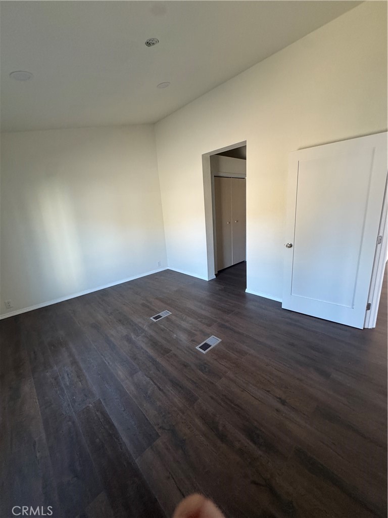 28110 Winchester Road Winchester, CA 92596 - Photo 11 of 36 a view of an empty room with wooden floor and closet