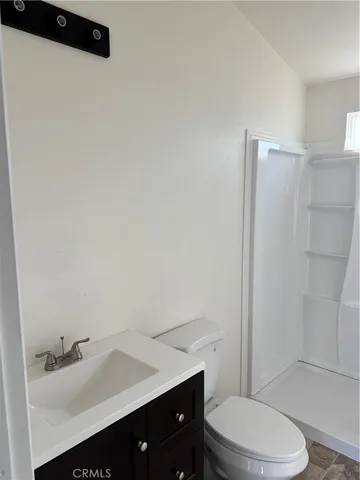 a bathroom with a sink toilet and vanity