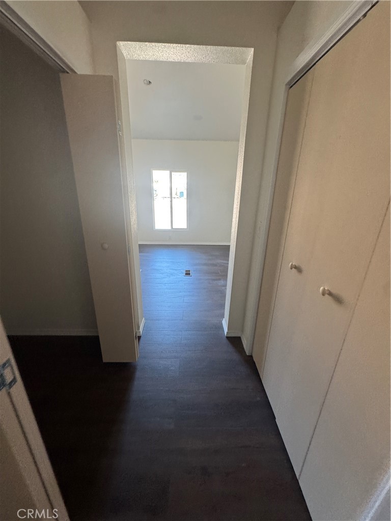 28110 Winchester Road Winchester, CA 92596 - Photo 16 of 36 en empty room with wooden floor and a window