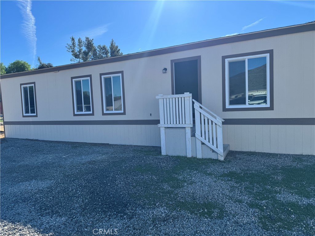 28110 Winchester Road Winchester, CA 92596 - Photo 3 of 36 front view of a house with a yard