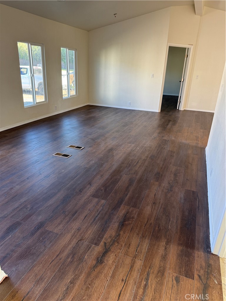 28110 Winchester Road Winchester, CA 92596 - Photo 34 of 36 an empty room with wooden floor and windows