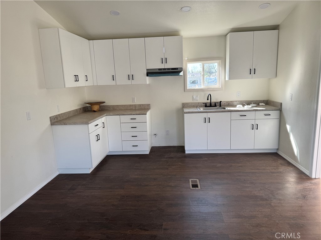 28110 Winchester Road Winchester, CA 92596 - Photo 38 of 40 a kitchen with granite countertop a stove a sink and a refrigerator