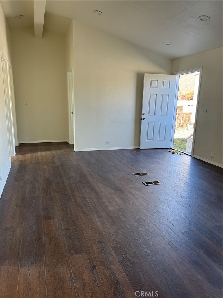 28110 Winchester Road Winchester, CA 92596 - Photo 7 of 36 an empty room with wooden floor and windows