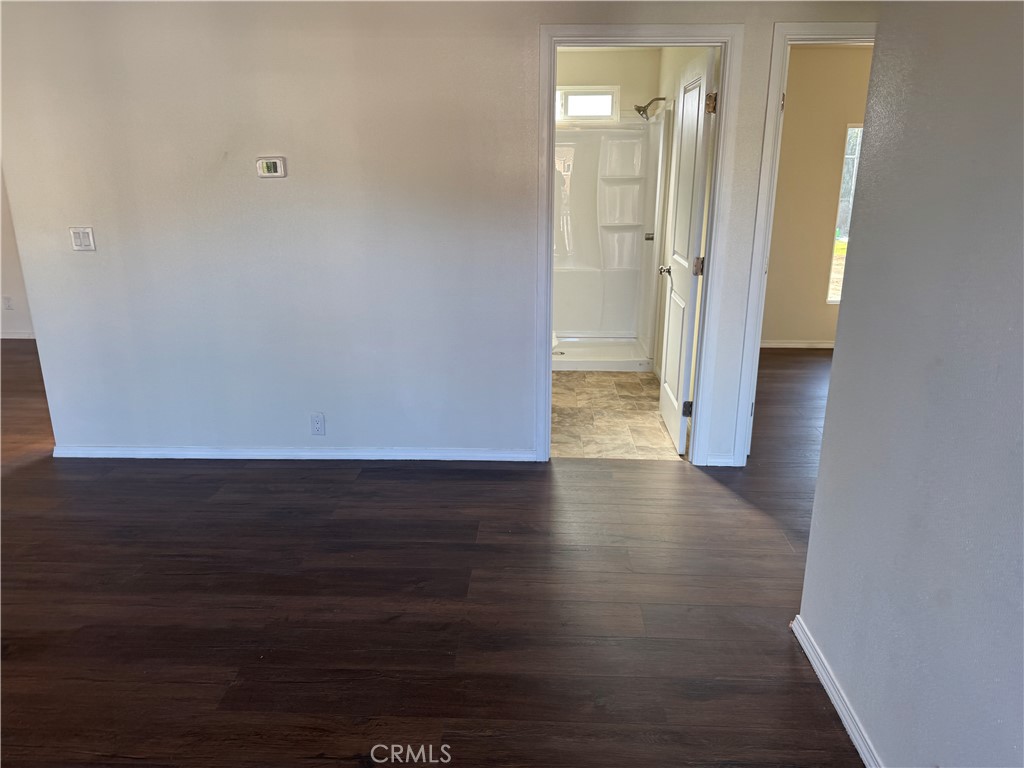 28110 Winchester Road Winchester, CA 92596 - Photo 9 of 36 a view of a hallway with wooden floor