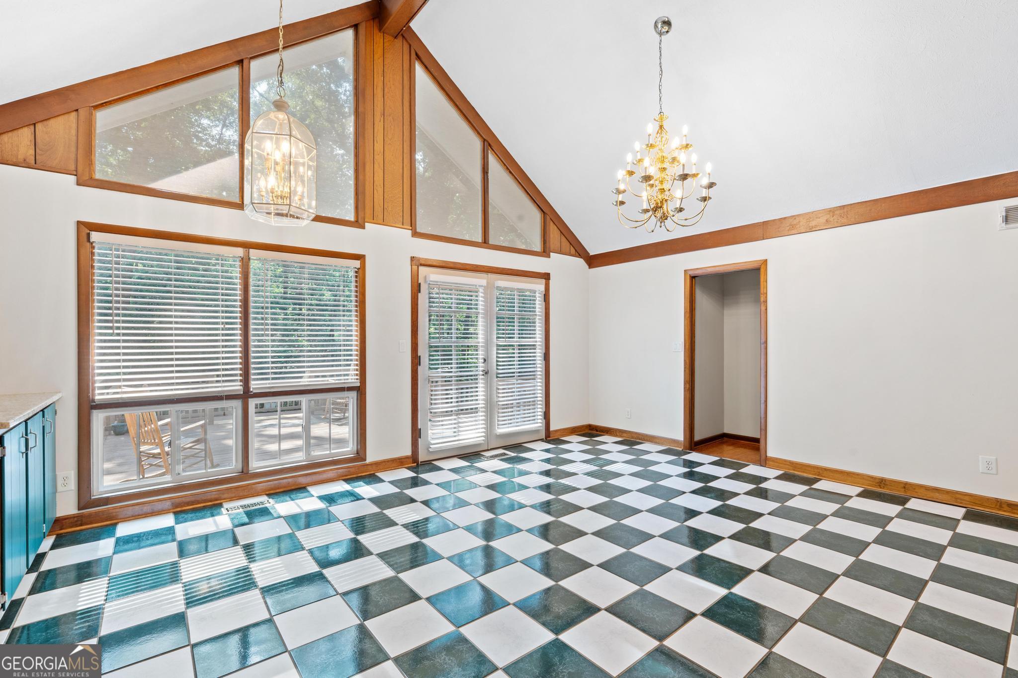 3071 White Road Northeast Conyers, GA 30012 - Photo 22 of 46 French doors to large backyard deck. Single door leads down to basement