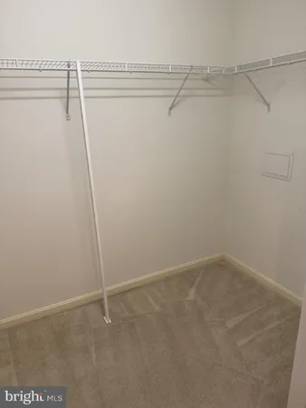 a bathroom with a granite countertop sink a toilet a mirror and shower