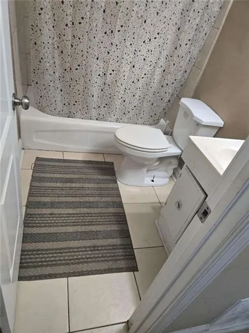 a bathroom with a toilet and a sink