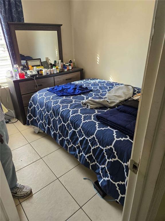 5578 Marbut Road Lithonia, GA 30058 - Photo 15 of 19 a bed sitting in a bedroom next to a window