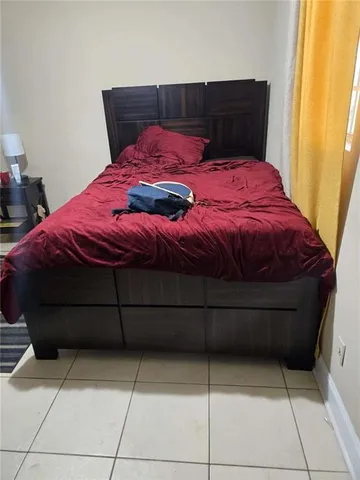 a bedroom with a bed and a closet