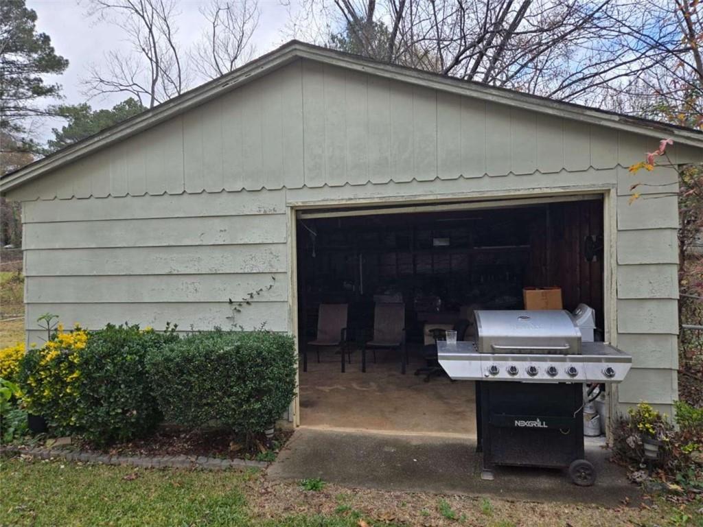 5578 Marbut Road Lithonia, GA 30058 - Photo 17 of 19 a couple of potted plants in front of door