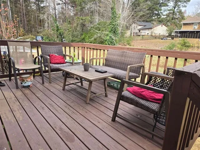 a view of sitting area on wooden deck