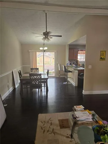 a living room with hard wood flooring
