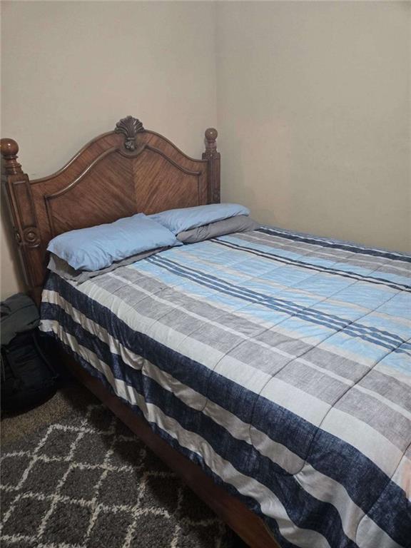 5578 Marbut Road Lithonia, GA 30058 - Photo 10 of 19 a bedroom with a bed and a mirror