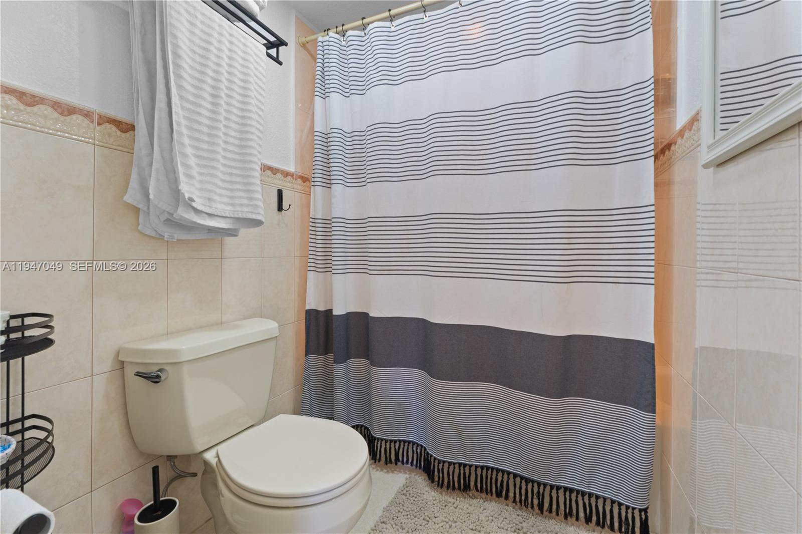 8075 Southwest 107th Avenue, Unit 221 Miami, FL 33173 - Photo 14 of 26 a bathroom with a sink and a toilet