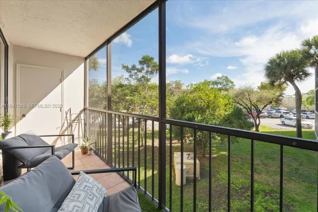 a view of a balcony with furniture