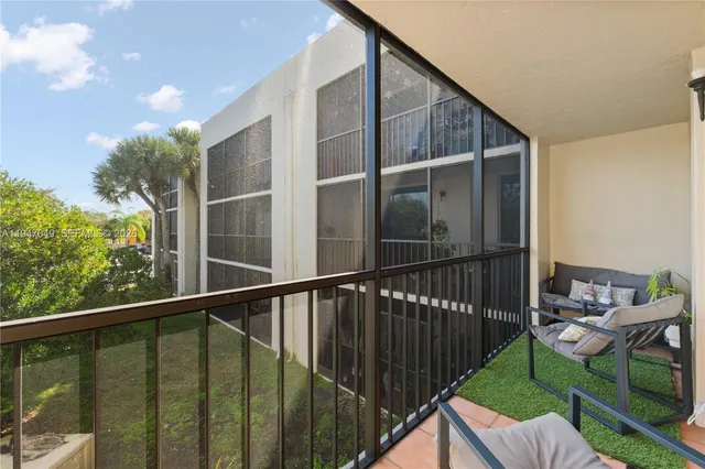 a view of balcony with furniture