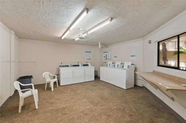 a view of a swimming pool and trees in the background