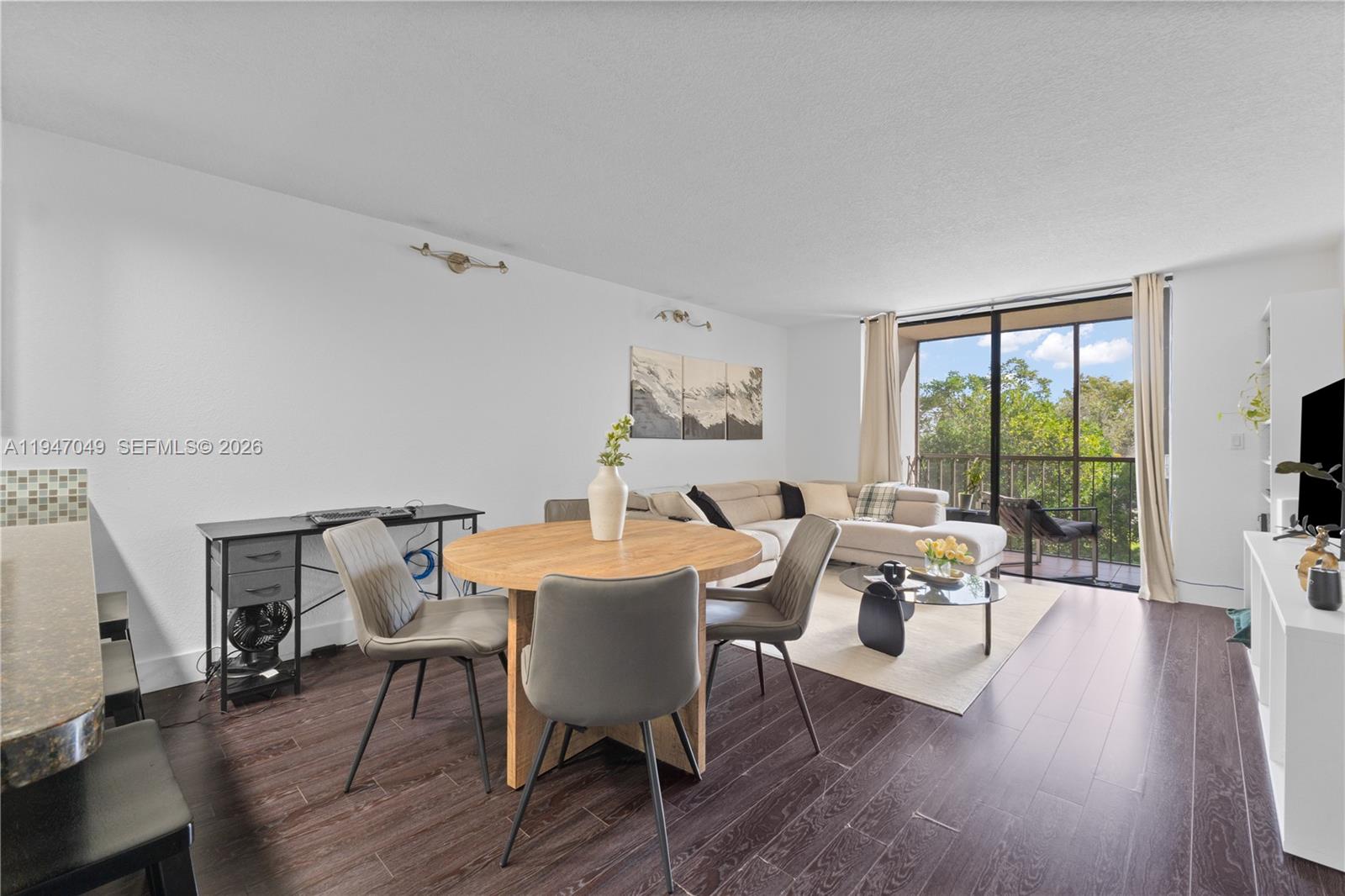 8075 Southwest 107th Avenue, Unit 221 Miami, FL 33173 - Photo 5 of 26 a living room with furniture and a large window