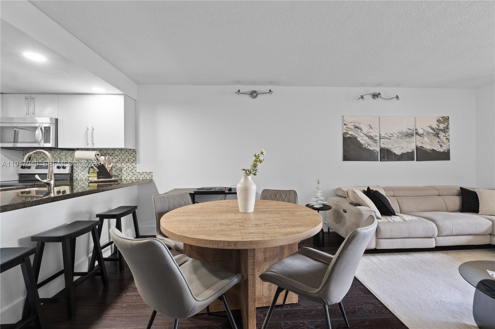 8075 Southwest 107th Avenue, Unit 221 Miami, FL 33173 - Photo 7 of 26 a view of a dining room with furniture