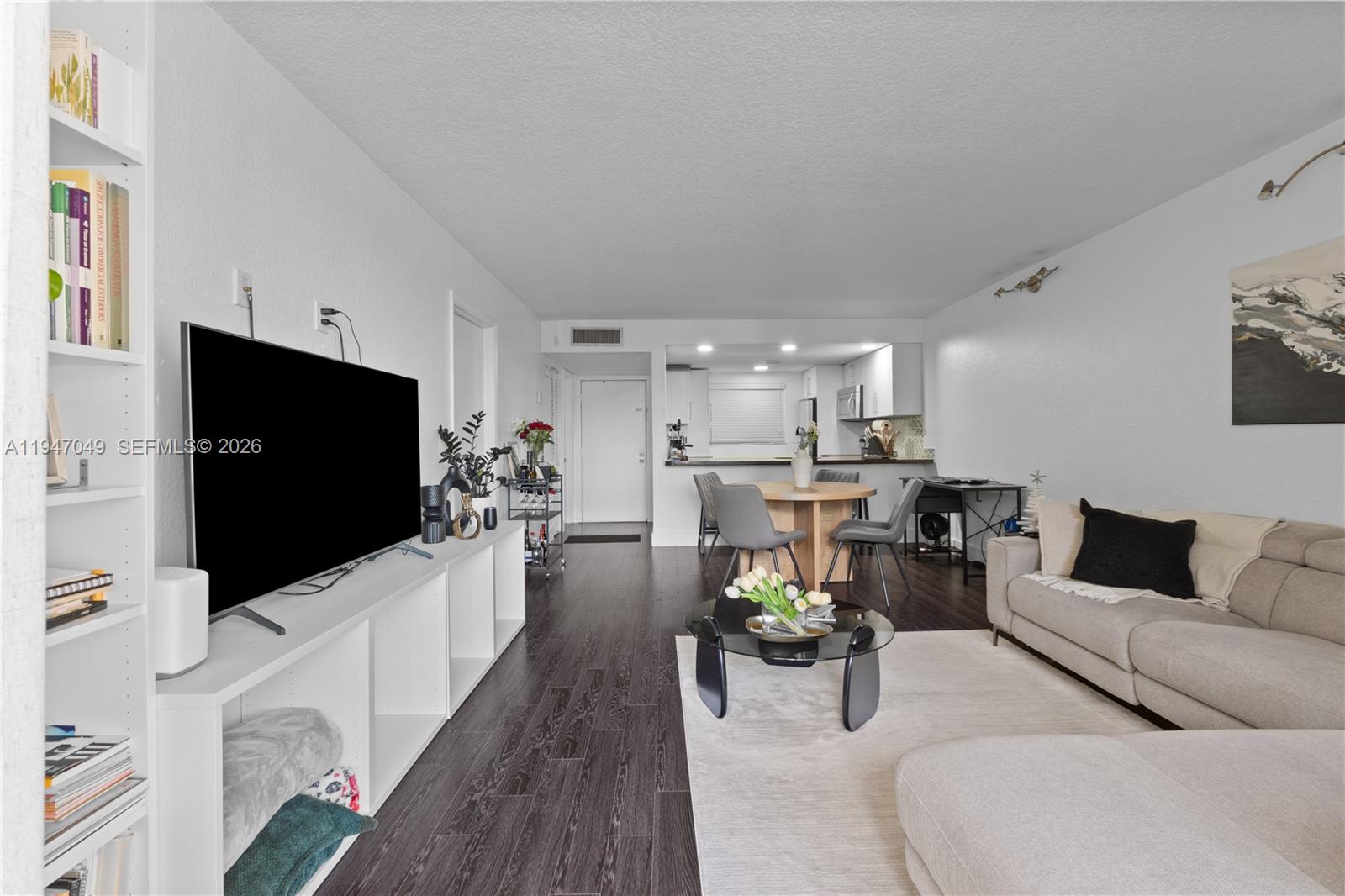 8075 Southwest 107th Avenue, Unit 221 Miami, FL 33173 - Photo 9 of 26 a living room with furniture and a flat screen tv