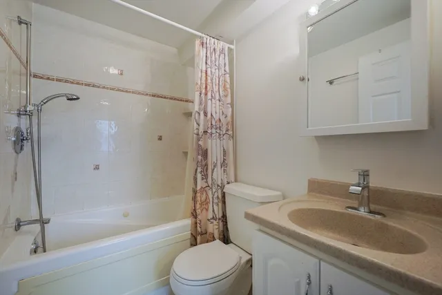 a view of a hallway with washer and dryer